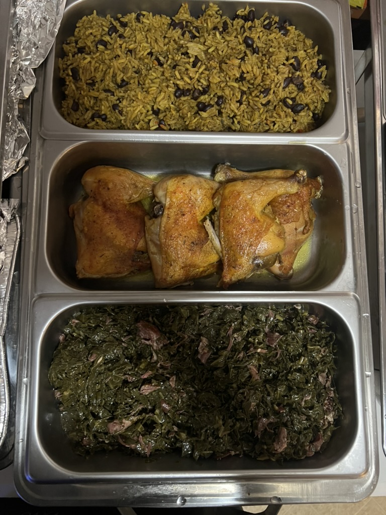 Catering platter with rice, chicken, and greens